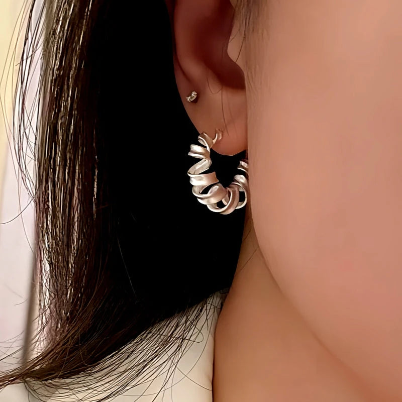 Close-up detail of the sparkling zircons and plating on the Frosted Wire Earrings
