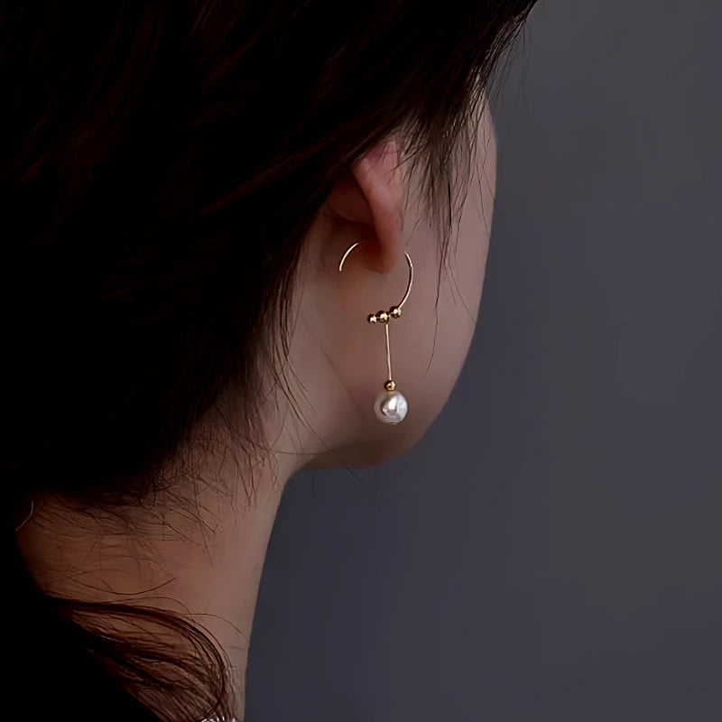 Model showcasing the dangle and style of the Sterling Silver Geometric Bead Earrings