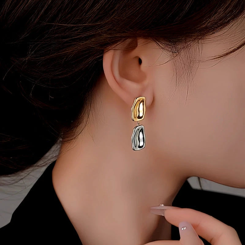 Model showcasing the dangle and style of the Sterling Silver Golden And Silver Drop Earrings