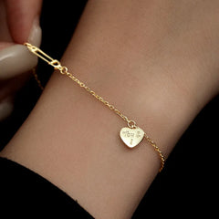 Model wearing the Sterling Silver Heart-Design Paper Clip Bracelets to highlight its design on the wrist