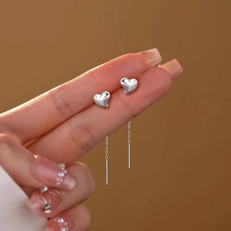 Angled view of the Sterling Silver Heart-Design Threader Earrings