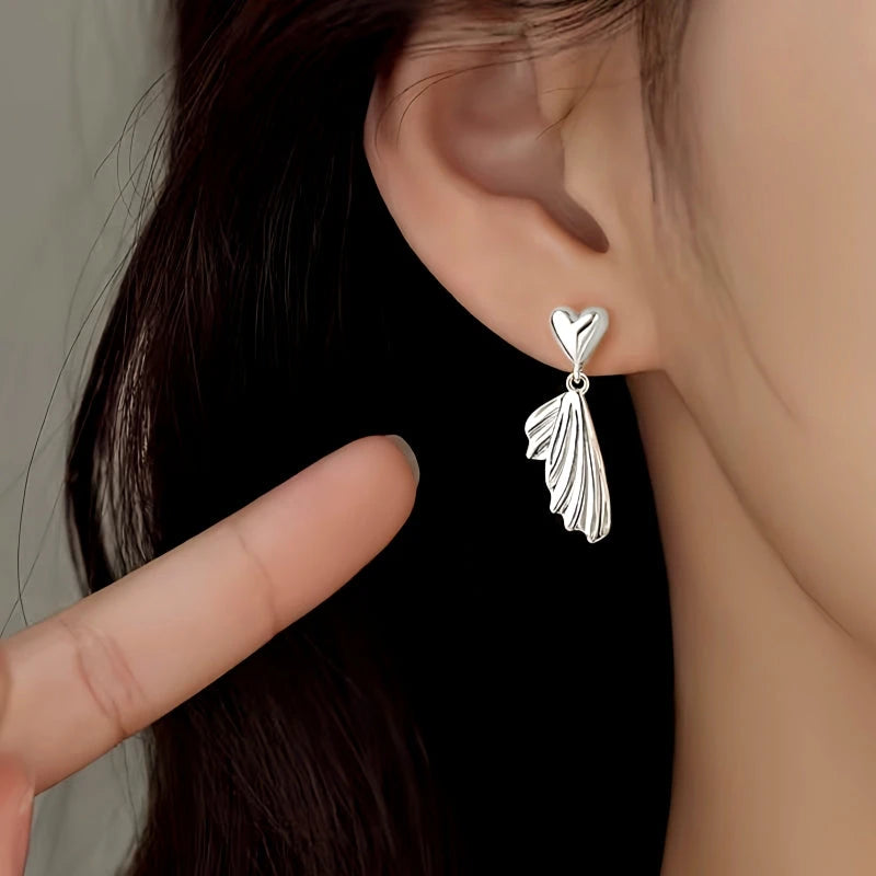 Close-up detail of the sparkling zircons and plating on the Fishtail Earrings