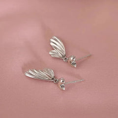 Angled view of the Sterling Silver Heart Fishtail Earrings