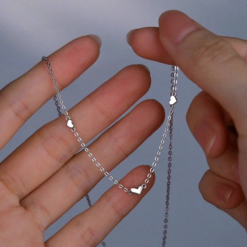 Sterling Silver Heart Necklace worn to showcase its length and pendant detail