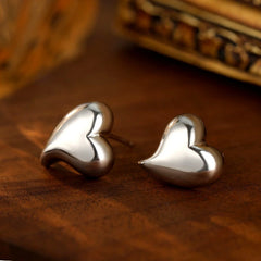 Close-up detail of the sparkling zircons and plating on the Heart Stud Earrings