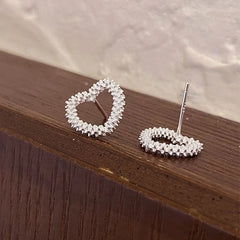 Close-up detail of the sparkling zircons and plating on the Heart Studs