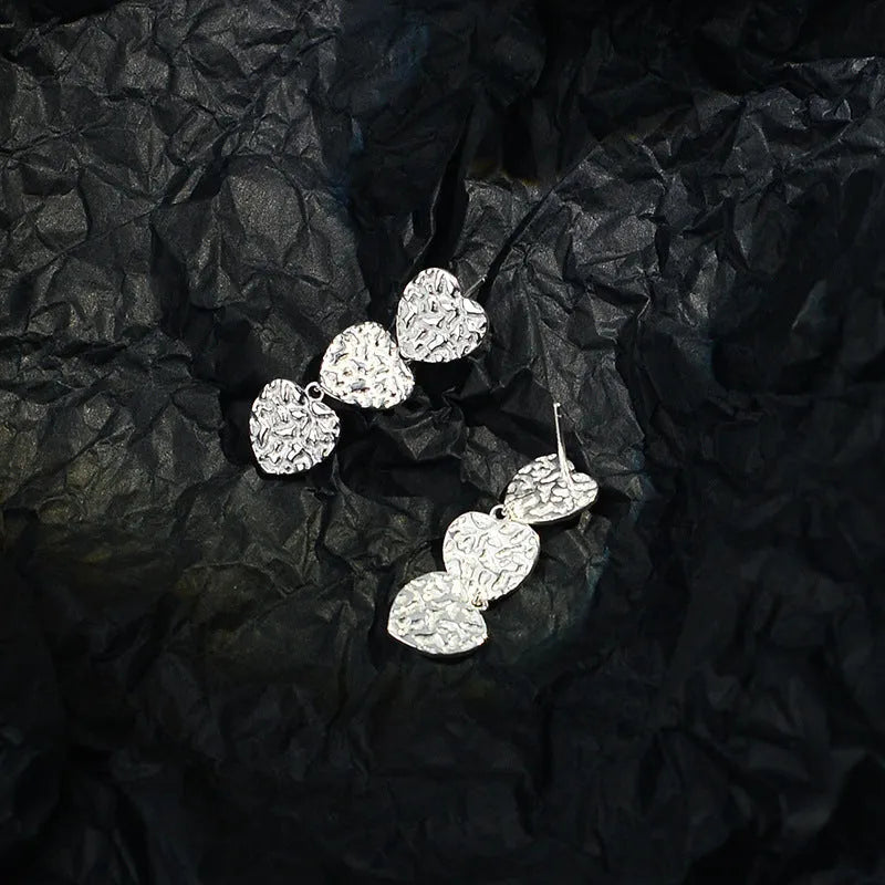 Close-up detail of the sparkling zircons and plating on the Tassel Earrings