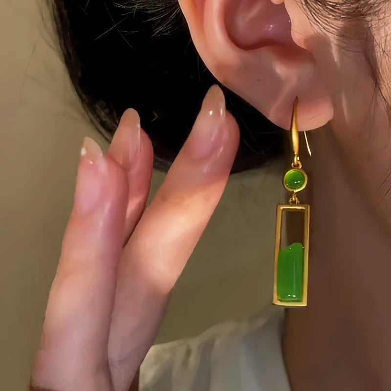 Model showcasing the dangle and style of the Sterling Silver Hetian Jasper Earrings