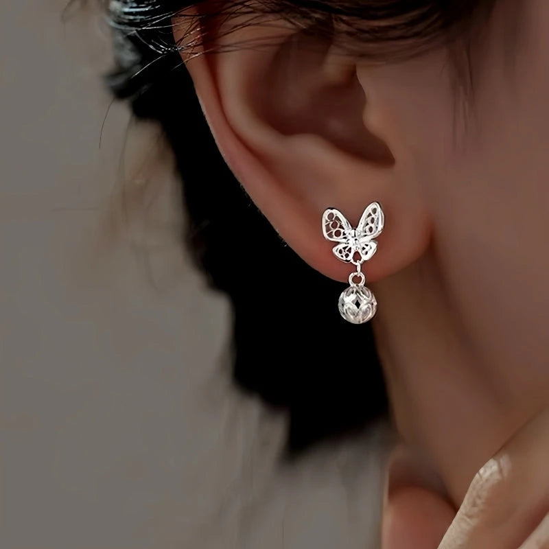 Close-up detail of the sparkling zircons and plating on the Hollow Butterfly Earrings