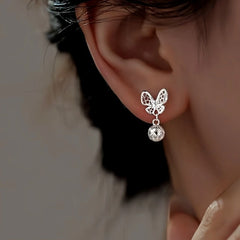 Close-up detail of the sparkling zircons and plating on the Hollow Butterfly Earrings