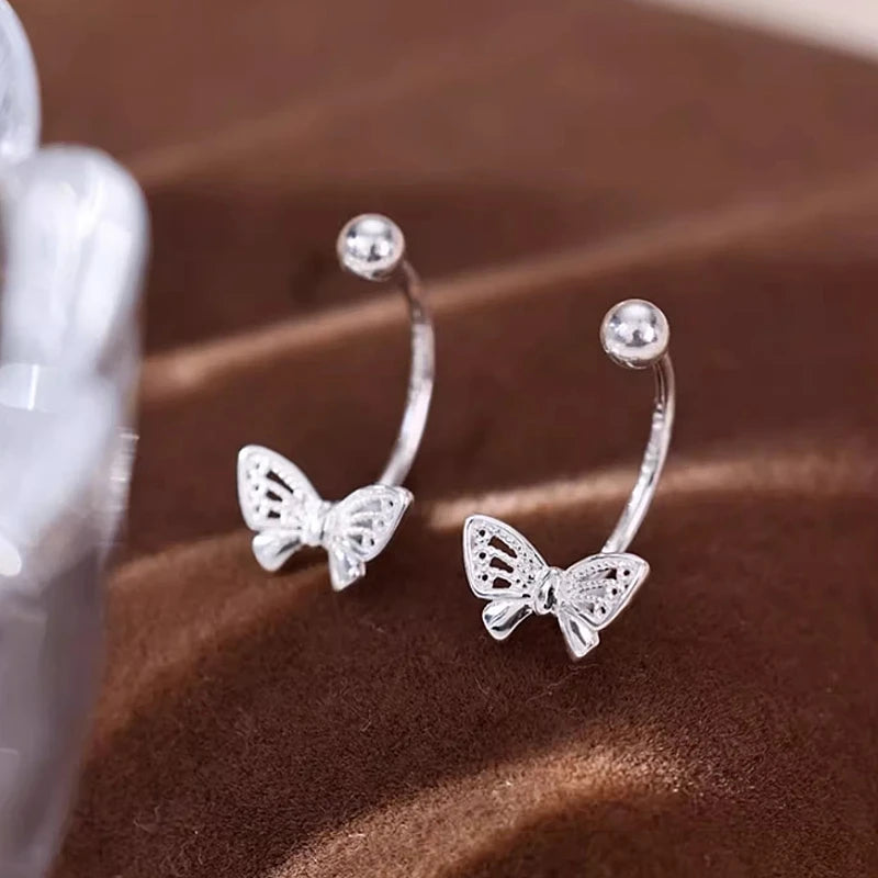 Close-up detail of the sparkling zircons and plating on the Butterfly Jacket Earrings