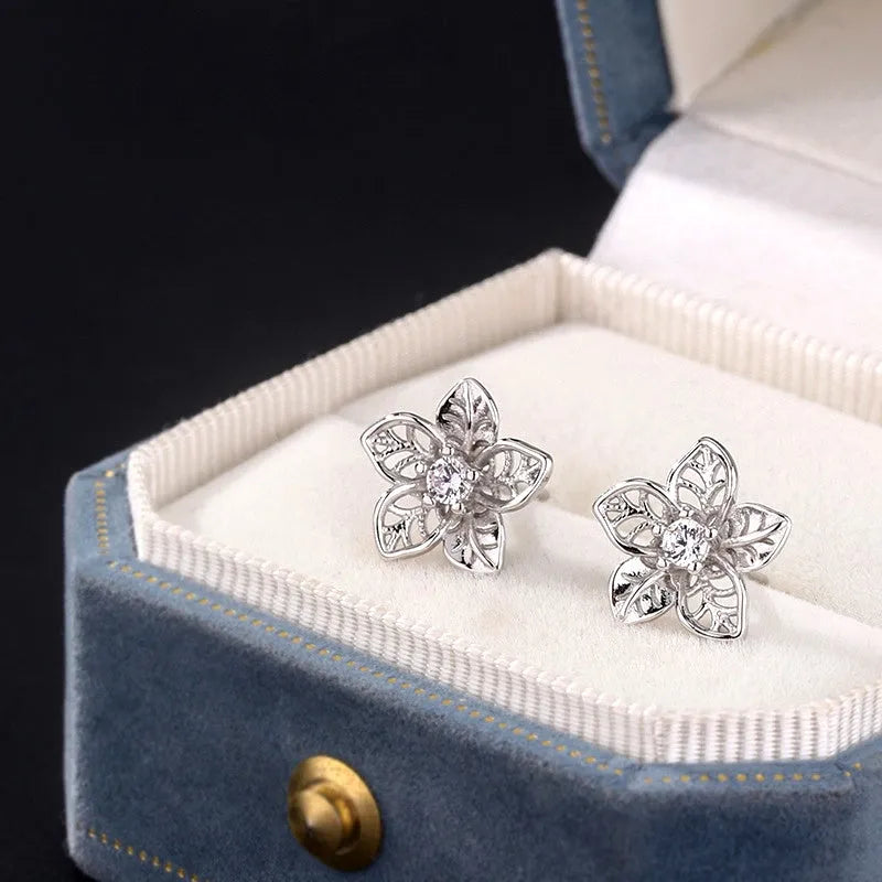 Close-up detail of the sparkling zircons and plating on the Hollow Flower Studs