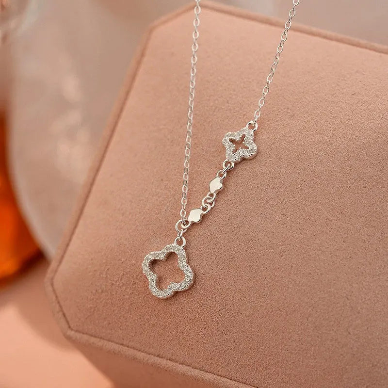 Close-up of the pendant and clasp on the Clover Flower Necklace