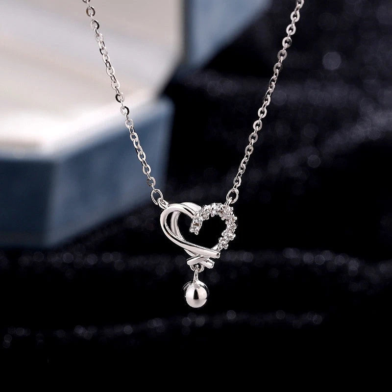 Sterling Silver Hollow Heart Necklace worn to showcase its length and pendant detail