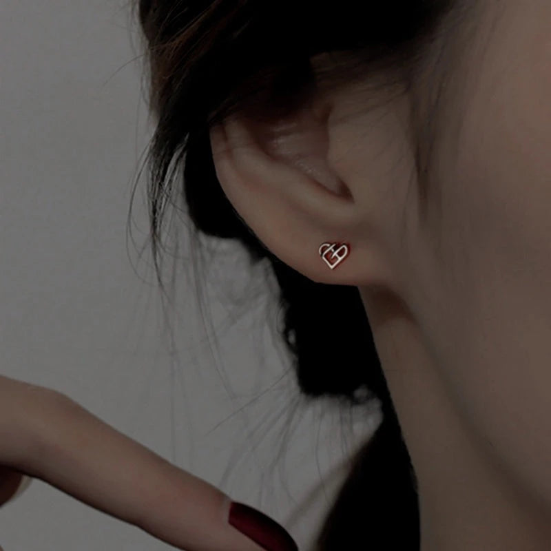 Styling the Hollow Heart Studs for a chic and modern look