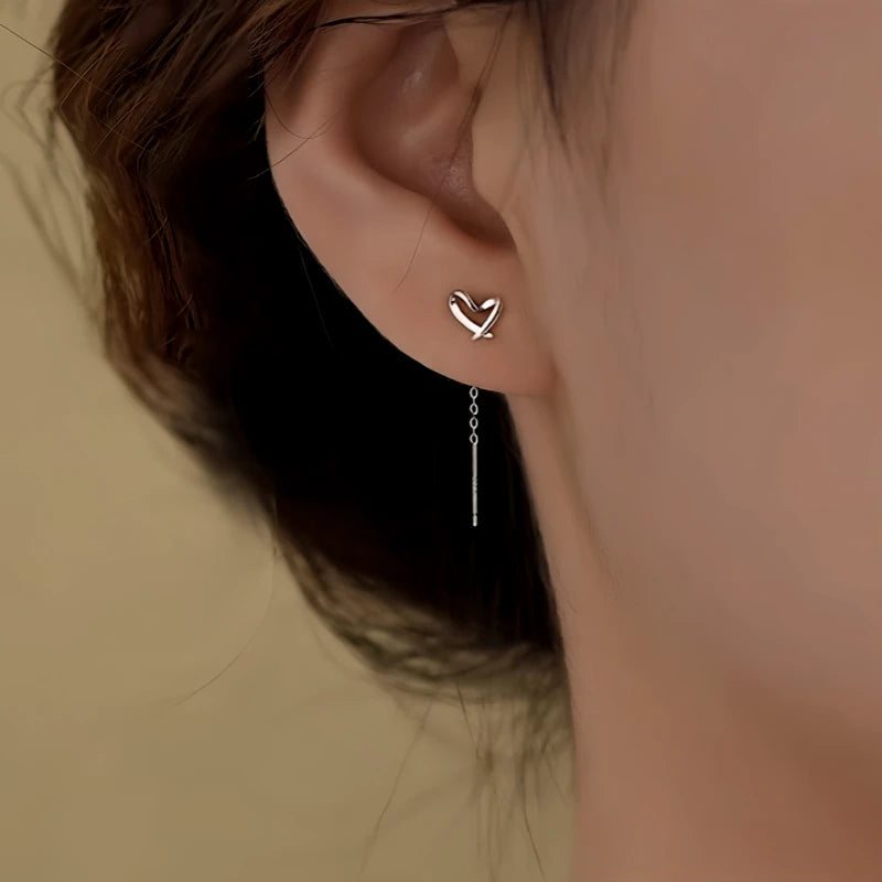 Close-up detail of the sparkling zircons and plating on the Heart Threader Earrings