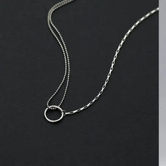 Sterling Silver Hollow Ring Necklace worn to showcase its length and pendant detail