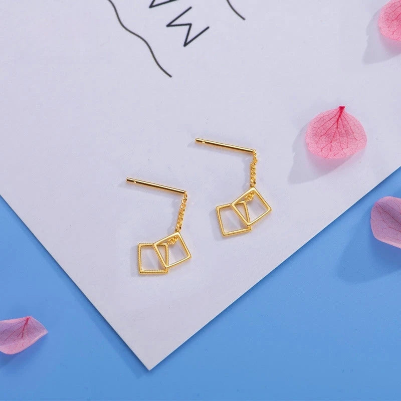 Angled view of the Sterling Silver Hollow Square Threader Earrings