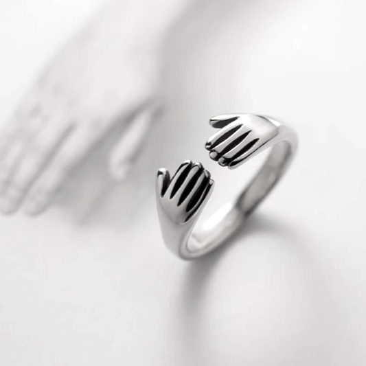 Sterling Silver Hug Palm RIngs worn on the hand to show its beautiful fit and design