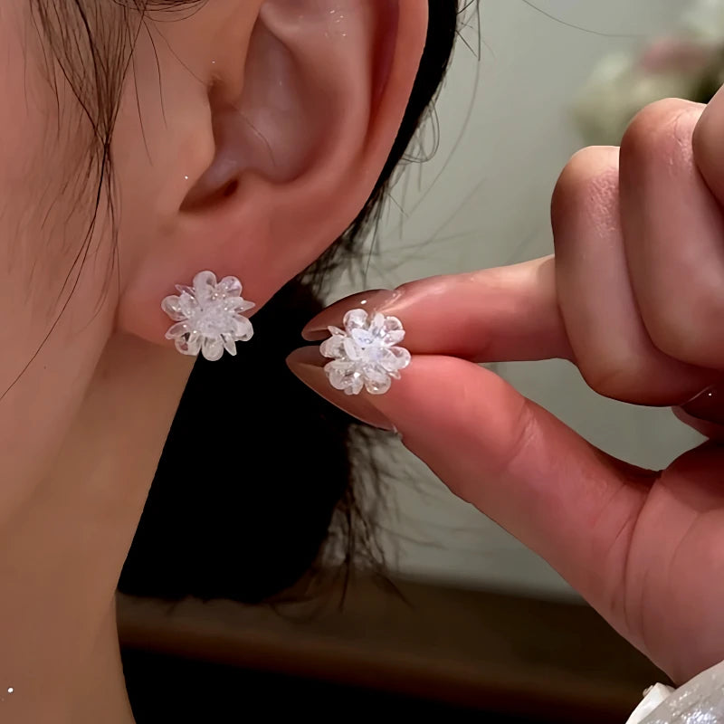 Angled view of the Sterling Silver Ice Flower Stud Earrings