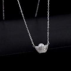 Close-up of the pendant and clasp on the Leaf Stud Earrings