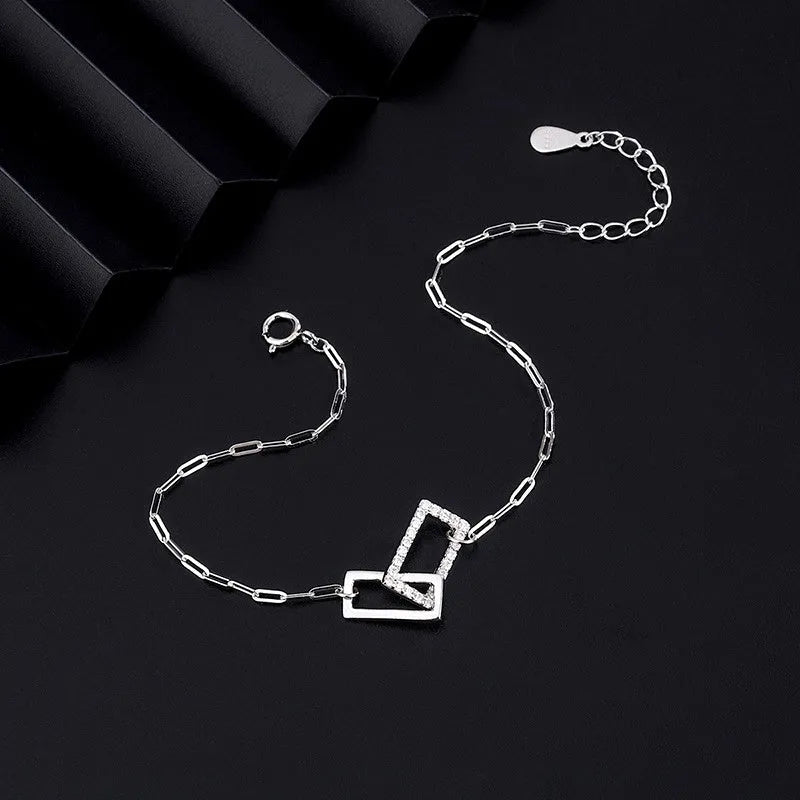 Close-up of the clasp and charm details on the Hollow Heart Earrings