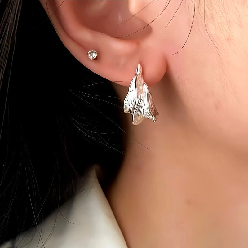 Close-up detail of the sparkling zircons and plating on the Bee Threader Earrings