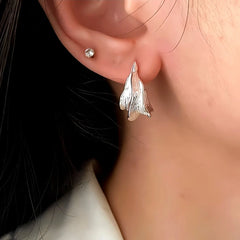 Close-up detail of the sparkling zircons and plating on the Bee Threader Earrings