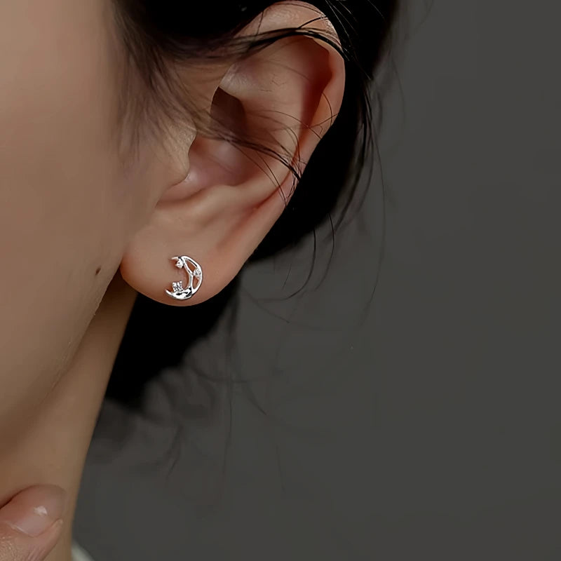 Model showcasing the dangle and style of the Sterling Silver Irregular Butterfly Moon Earrings