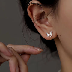 Close-up detail of the sparkling zircons and plating on the Spiral Stud Earrings