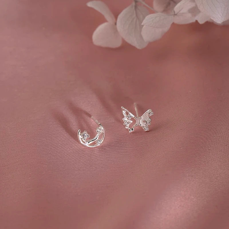 Angled view of the Sterling Silver Irregular Butterfly Moon Earrings