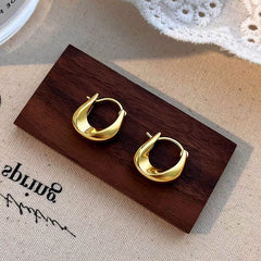 Angled view of the Sterling Silver Irregular Earrings