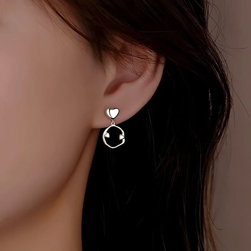 Close-up detail of the sparkling zircons and plating on the Oval Threader Earrings