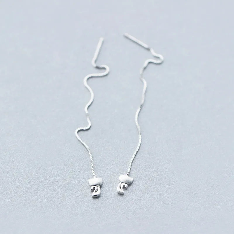 Model showcasing the dangle and style of the Sterling Silver Kitten Threader Earrings