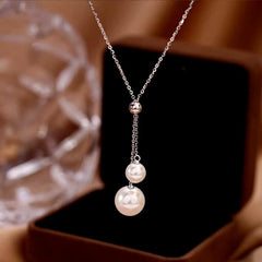 Close-up of the pendant and clasp on the Hug Ring