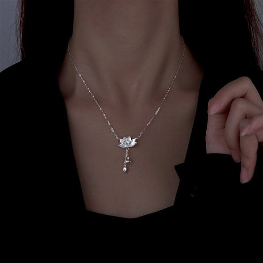 Sterling Silver Lotus Tassel Necklace worn to showcase its length and pendant detail