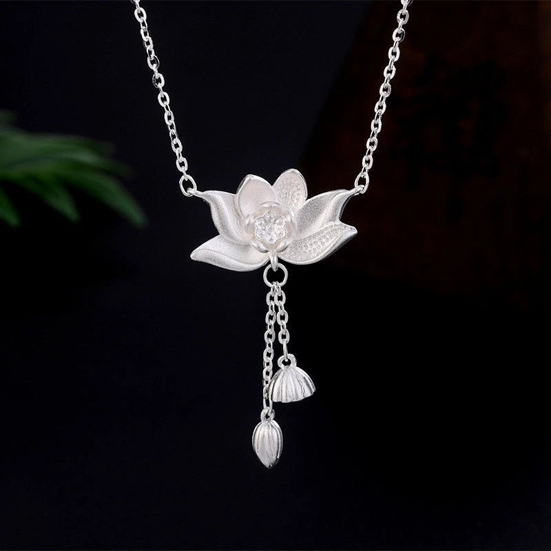 Close-up of the pendant and clasp on the Heart Hoop Earrings