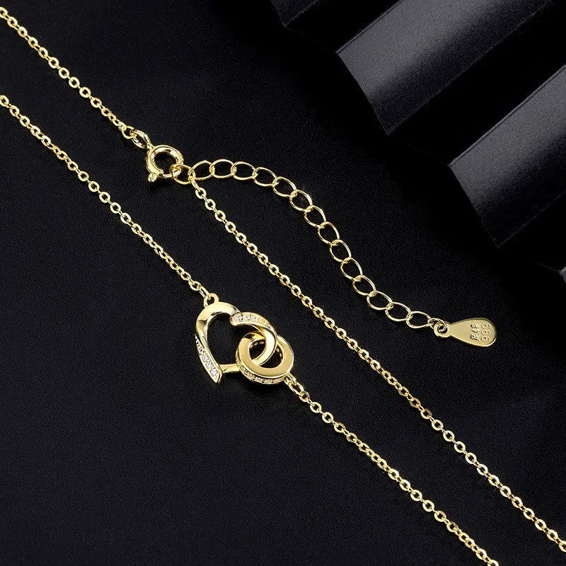 Detailed view of the Sterling Silver Love Double Ring Necklace chain and pendant