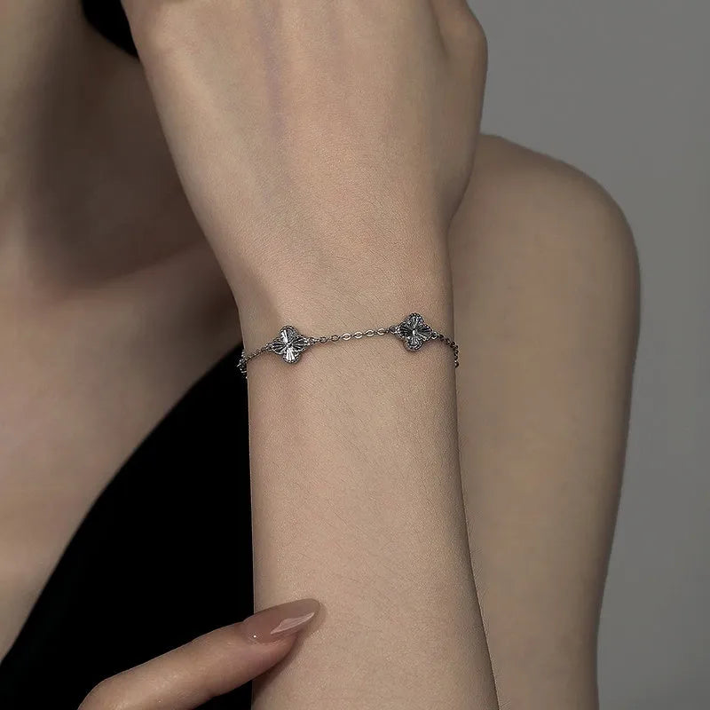 Model wearing the Sterling Silver Lucky Four-Leaf Clover Bracelets to highlight its design on the wrist