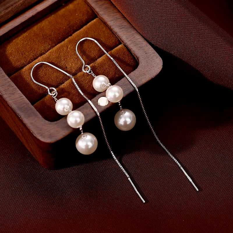 Close-up detail of the sparkling zircons and plating on the Lotus Tassel Earrings