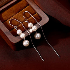 Close-up detail of the sparkling zircons and plating on the Lotus Tassel Earrings