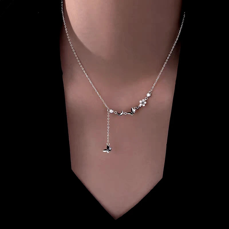 Close-up of the pendant and clasp on the Love Angel Wing Necklace