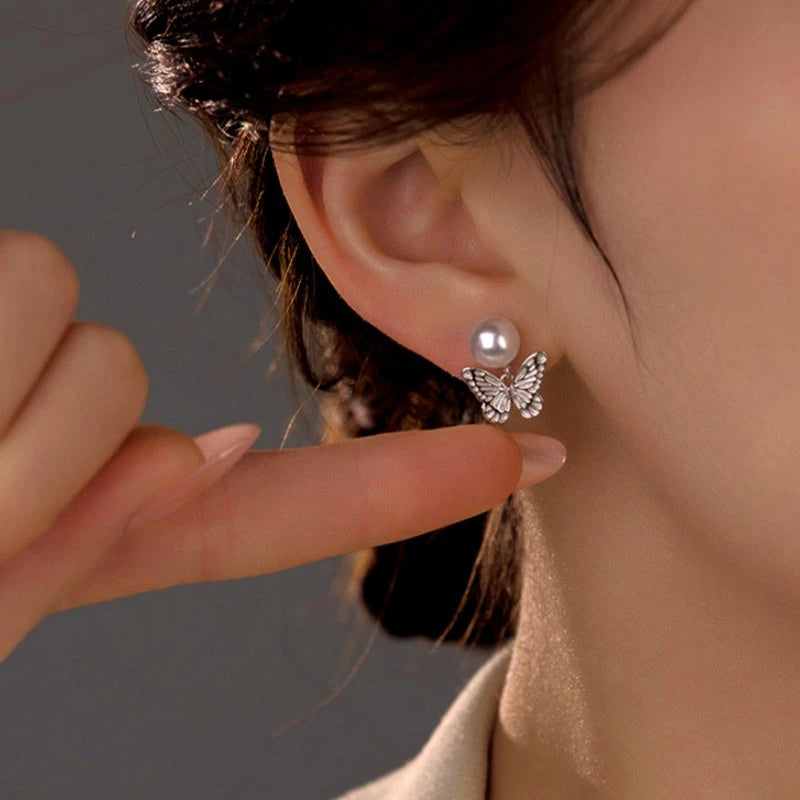 Close-up detail of the sparkling zircons and plating on the Asymmetrical Stud Earrings