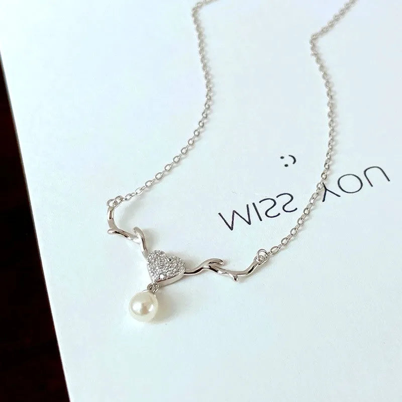 Close-up of the pendant and clasp on the Mum Necklace