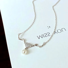 Close-up of the pendant and clasp on the Mum Necklace