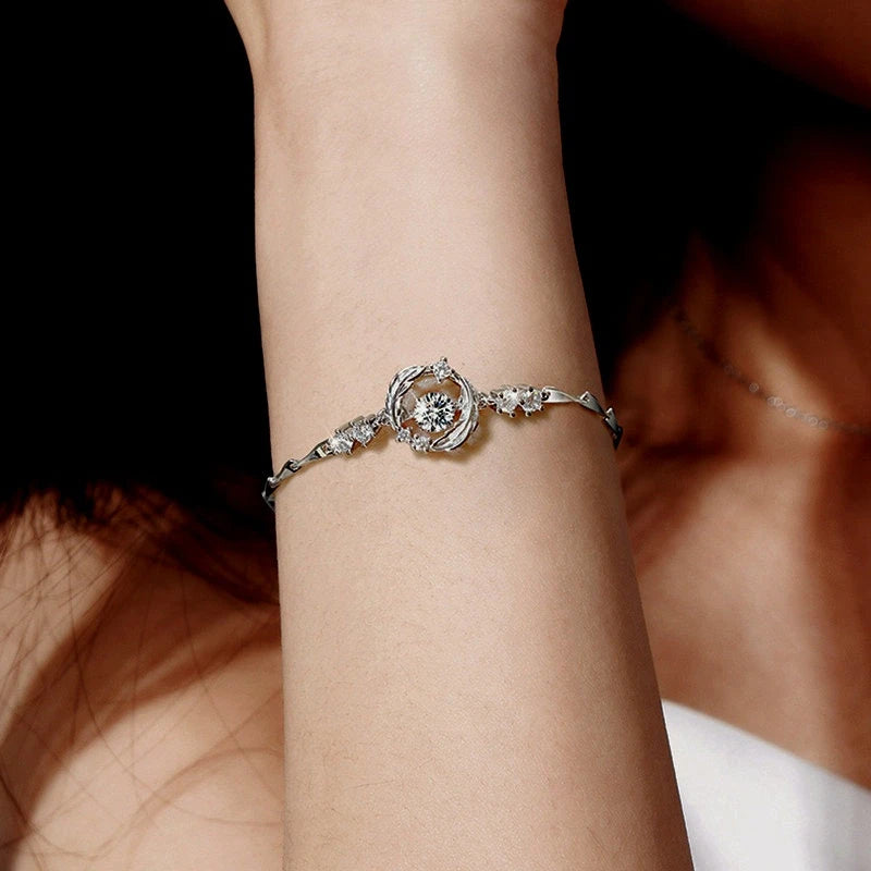 Model wearing the Sterling Silver Luxury Feather You Accompany Moissanite Bracelets to highlight its design on the wrist