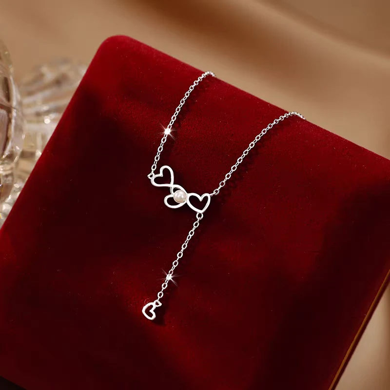 Sterling Silver Luxury Love Pearl Tassel Necklace worn to showcase its length and pendant detail