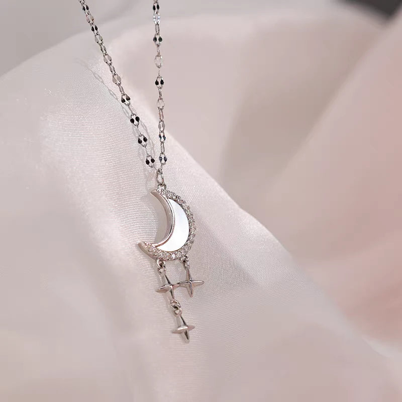 Close-up of the pendant and clasp on the Moon and Star Necklace
