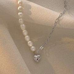 Close-up of the pendant and clasp on the Pearl Heart Necklace