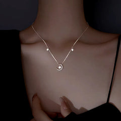 Sterling Silver Luxury Star And Moon Necklace worn to showcase its length and pendant detail